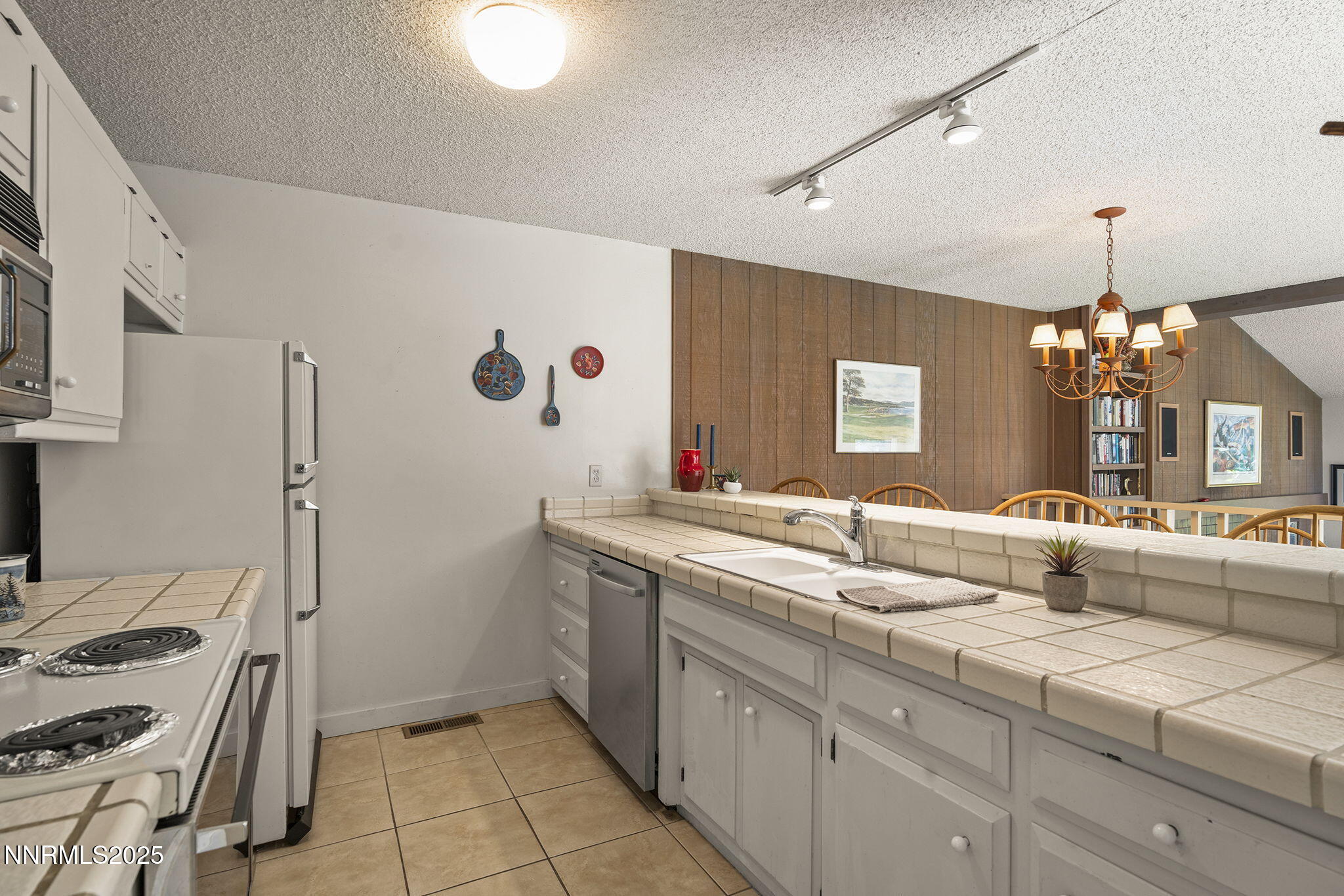 954 Fairway Boulevard, Unit 4 Incline Village, NV 89451 - Photo 20 of 28 a bathroom with a sink and a mirror