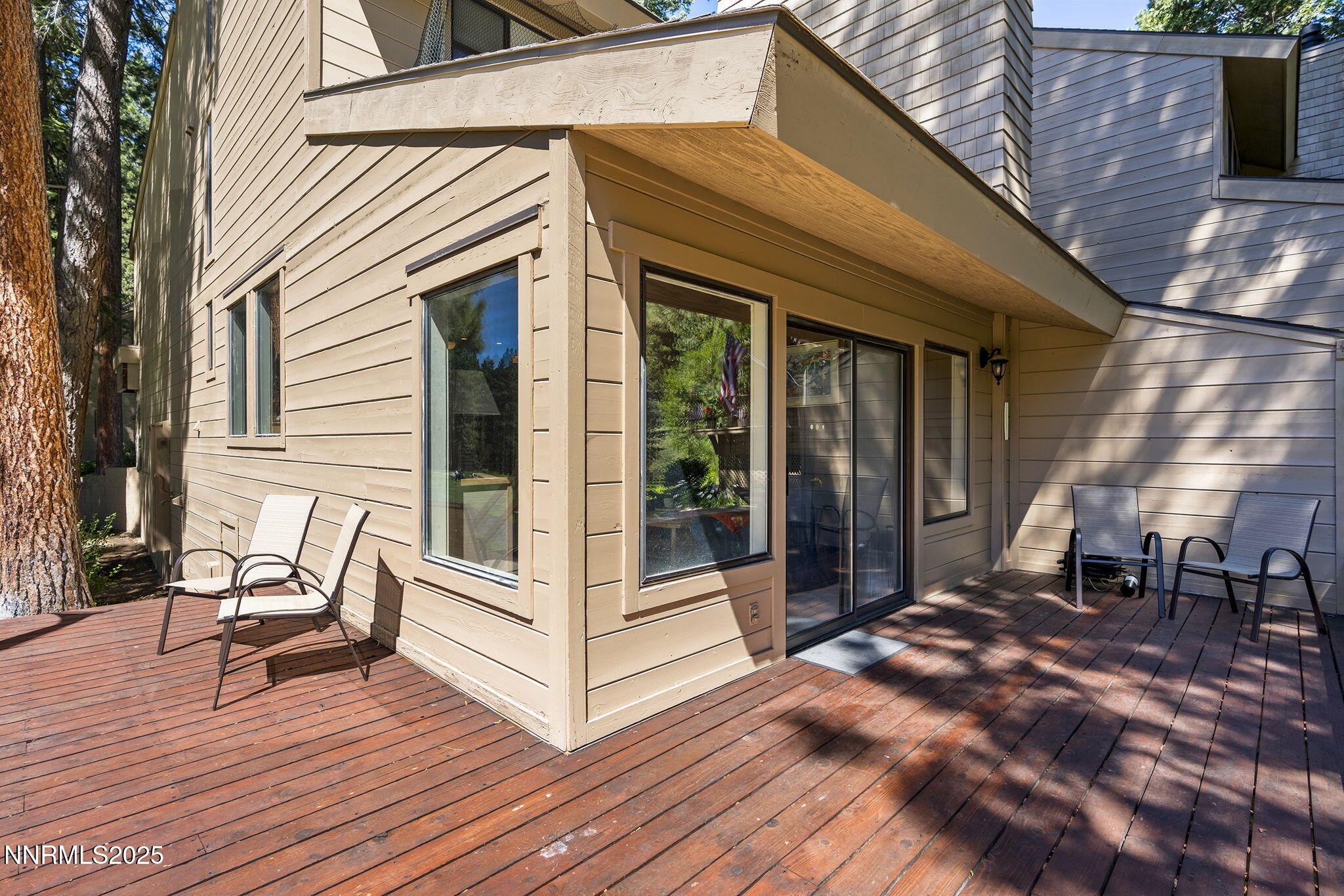 954 Fairway Boulevard, Unit 4 Incline Village, NV 89451 - Photo 22 of 28 a view of patio with a table and chairs and wooden floor
