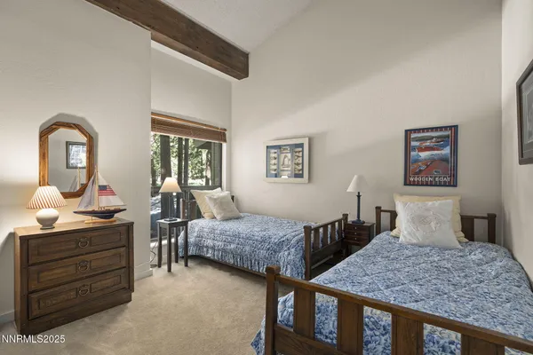 a bedroom with bed and window