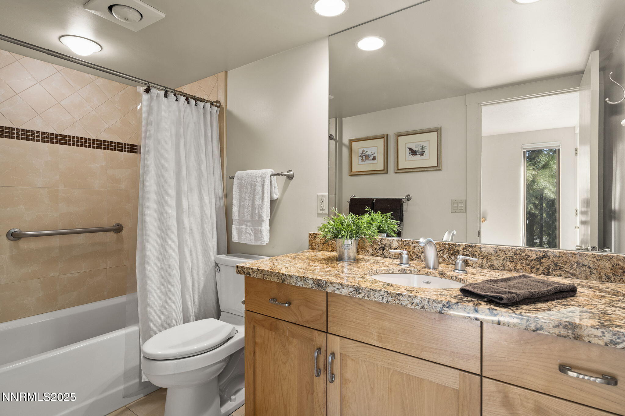 954 Fairway Boulevard, Unit 4 Incline Village, NV 89451 - Photo 25 of 28 a bathroom with a granite countertop sink toilet and shower