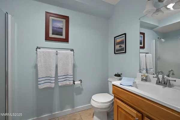 a bathroom with a sink toilet and vanity