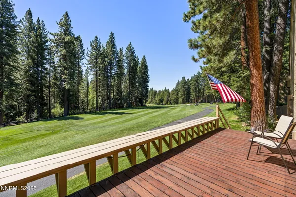 a park view with a wooden floor and trees