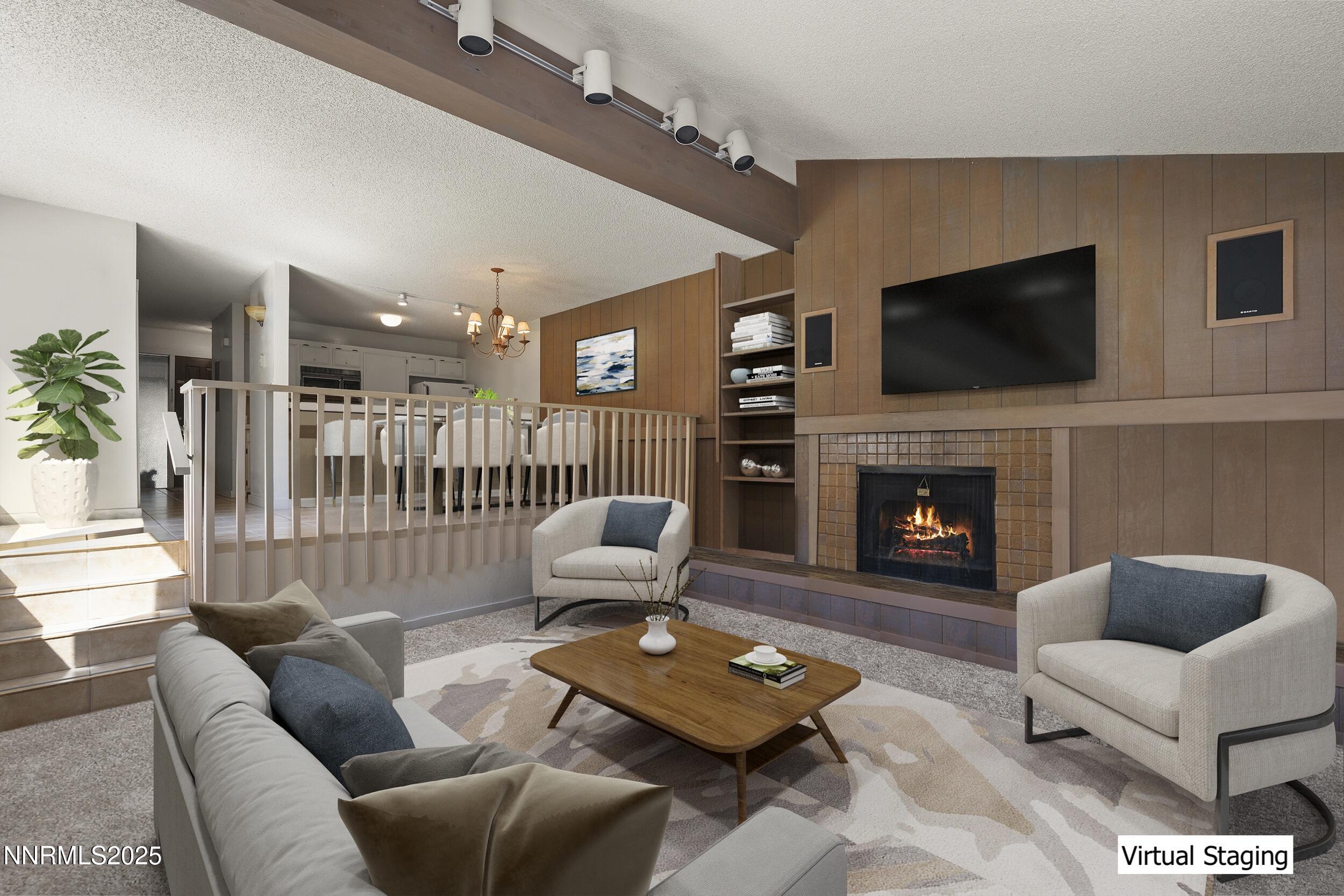 954 Fairway Boulevard, Unit 4 Incline Village, NV 89451 - Photo 4 of 28 a living room with furniture a flat screen tv and a fireplace