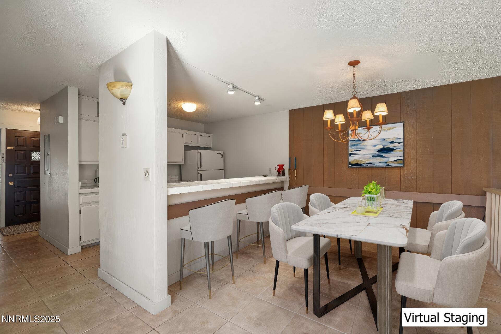 954 Fairway Boulevard, Unit 4 Incline Village, NV 89451 - Photo 6 of 28 a view of a dining room with furniture and chandelier