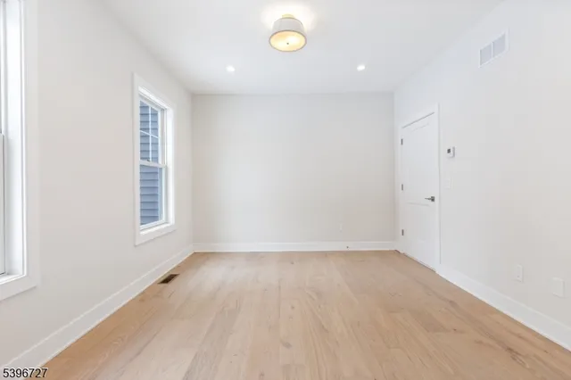 a bathroom with a sink vanity and a mirror