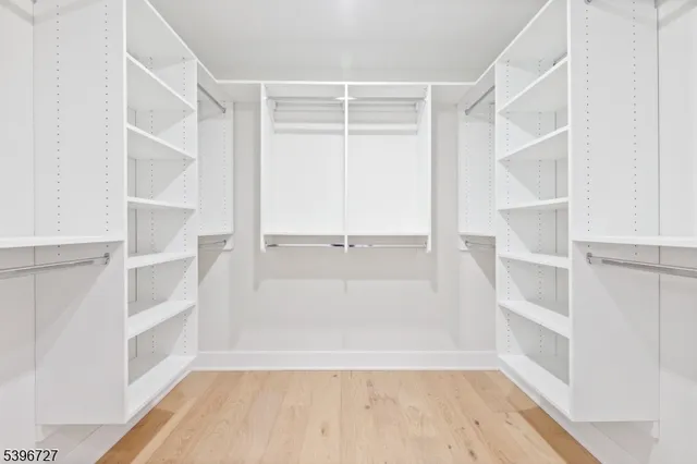 a spacious bathroom with a bathtub sink and toilet