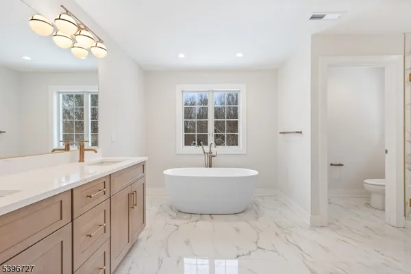 a bathroom with a sink a toilet and a bathtub