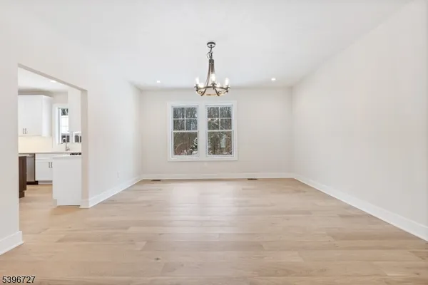a kitchen with cabinets appliances and a window