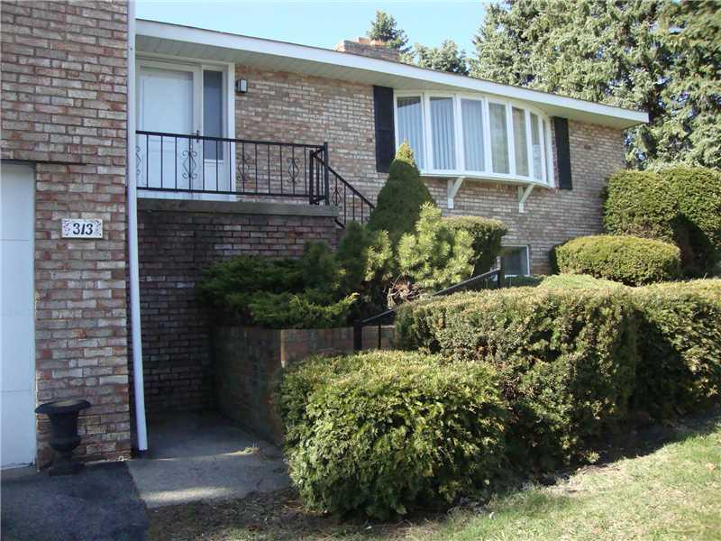 313 Madison Heights Road New Stanton, PA 15672 - Photo 25 of 25 Facade/Exterior Front. WELCOME HOME! Mature Landscape, Paved Drive, Entry-door to Lower Garage/Basement Level. HOME WARRANTY included