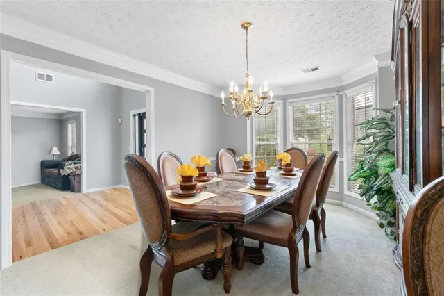 a view of a dining room with furniture window and outside view
