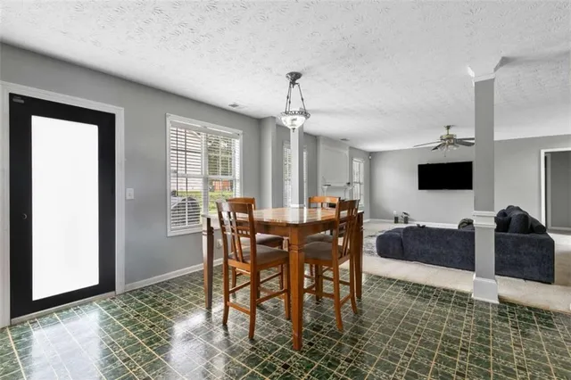 a view of a dining room with furniture