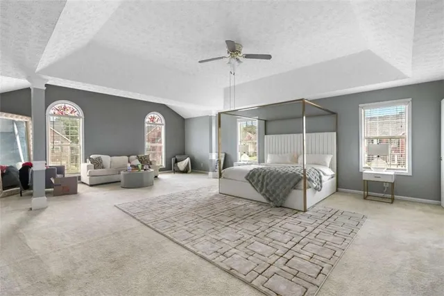 a bedroom with a bed and a couch