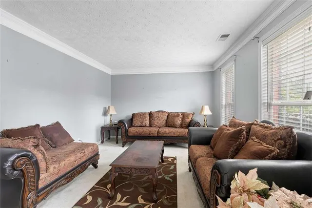 a living room with furniture and a couch