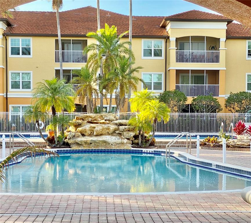 5451 Vineland Road, Unit 2309 Orlando, FL 32811 - Photo 1 of 38 a front view of a house with swimming pool