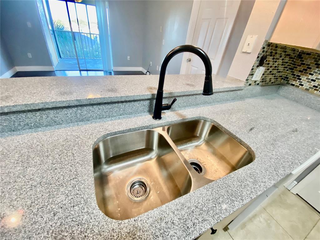 5451 Vineland Road, Unit 2309 Orlando, FL 32811 - Photo 11 of 38 a close view of sink and tap