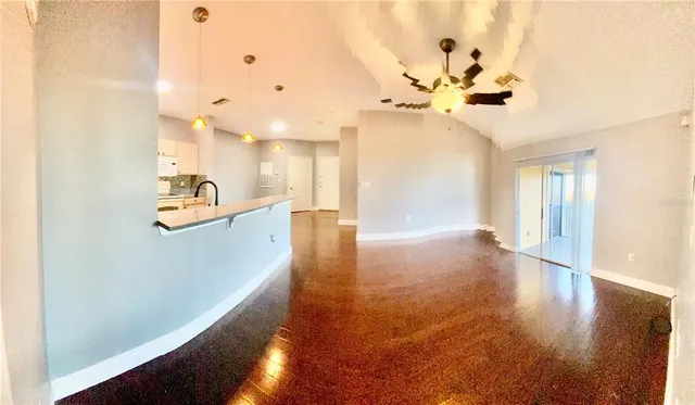 a kitchen with a stove a sink and a refrigerator