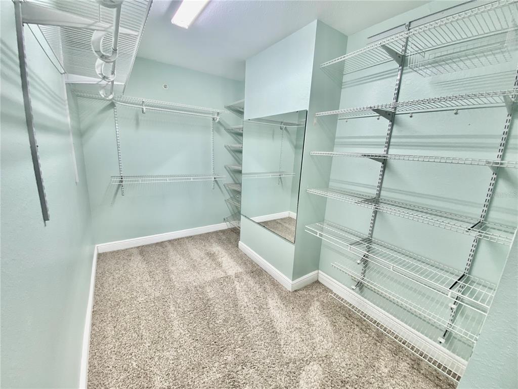 5451 Vineland Road, Unit 2309 Orlando, FL 32811 - Photo 19 of 38 a view of walk in closet