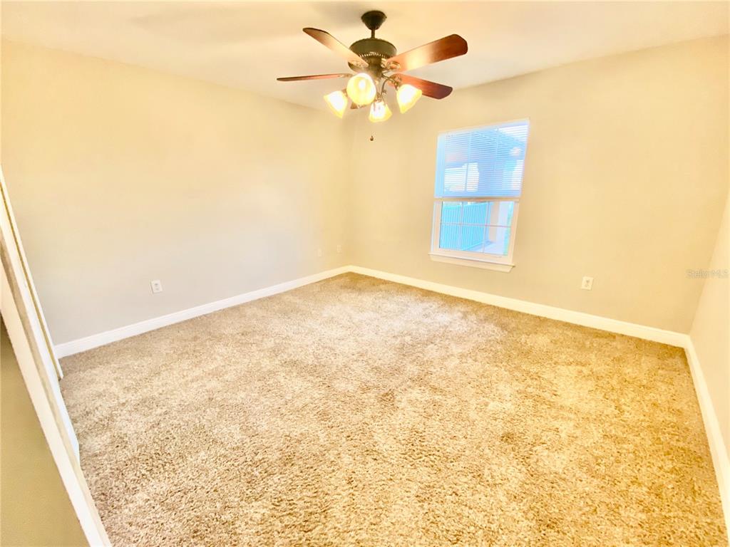 5451 Vineland Road, Unit 2309 Orlando, FL 32811 - Photo 29 of 38 a view of an empty room and window