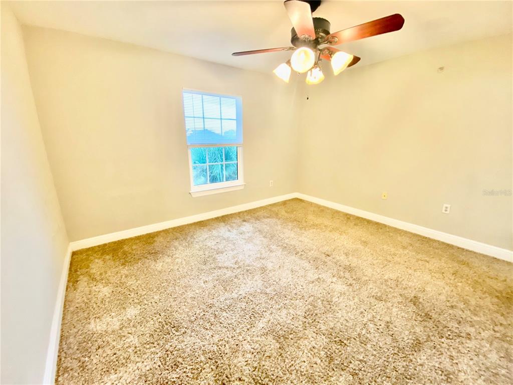 5451 Vineland Road, Unit 2309 Orlando, FL 32811 - Photo 30 of 38 en empty room with windows