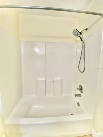 a bathroom with a sink a mirror and a shower