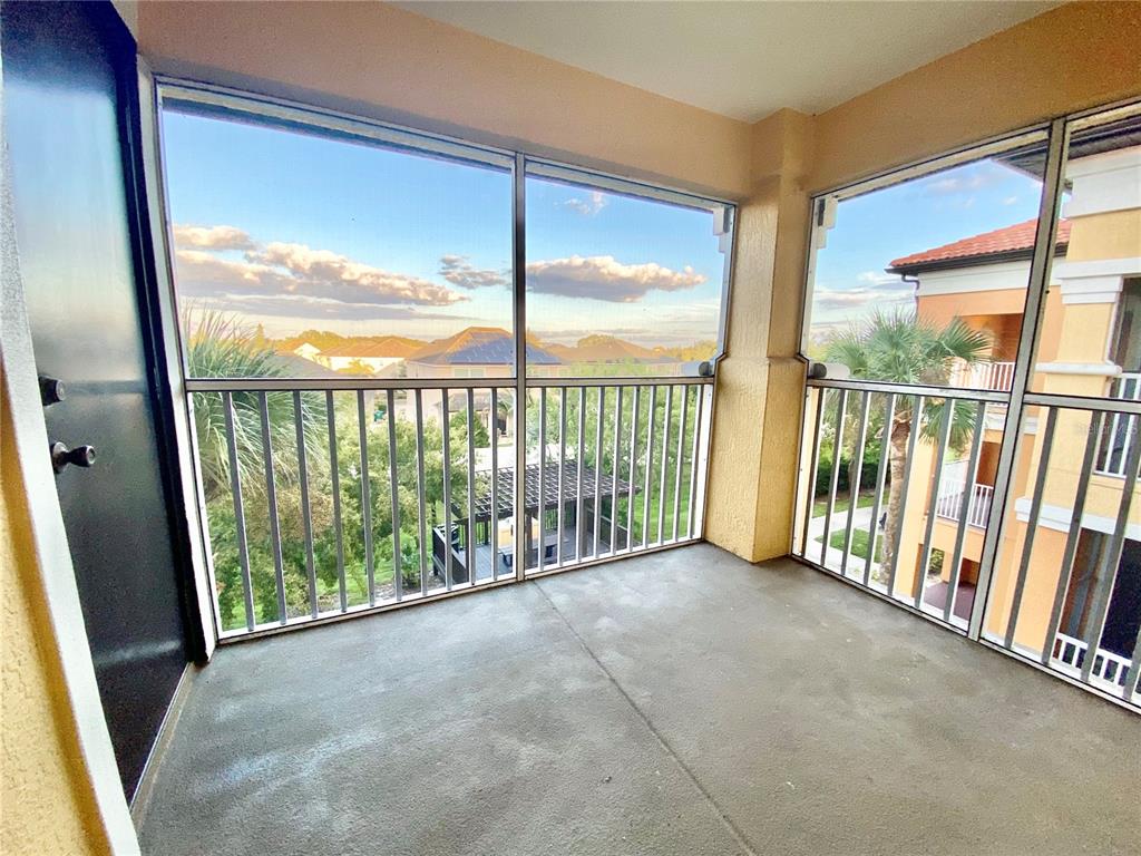 5451 Vineland Road, Unit 2309 Orlando, FL 32811 - Photo 36 of 38 a view of a room with wooden floor and city view