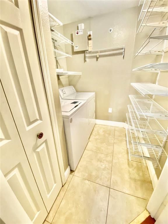 5451 Vineland Road, Unit 2309 Orlando, FL 32811 - Photo 38 of 38 a bathroom with a sink a toilet a mirror and vanity