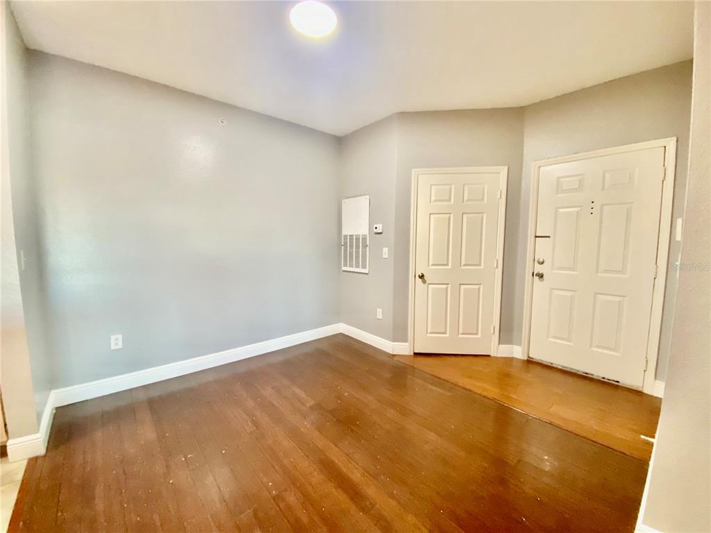 5451 Vineland Road, Unit 2309 Orlando, FL 32811 - Photo 6 of 38 an empty room with an entryway