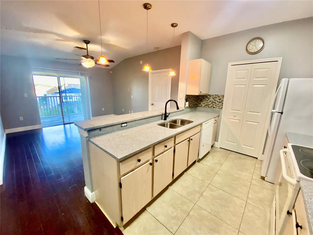 5451 Vineland Road, Unit 2309 Orlando, FL 32811 - Photo 7 of 38 a spacious bathroom with a sink a large mirror and a shower