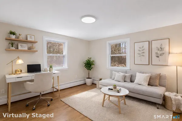 a view of a room with window and wooden floor