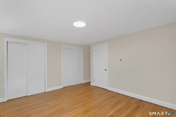 a bed room with a bed and a window