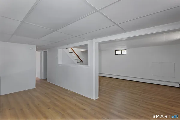 a utility room with cabinets washer and dryer