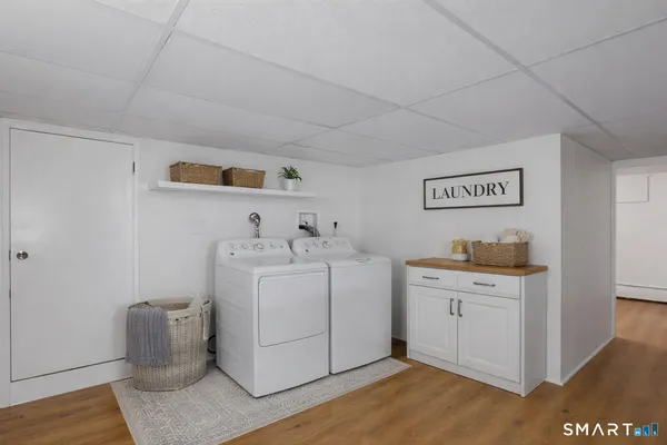 a view of a room with wooden floor