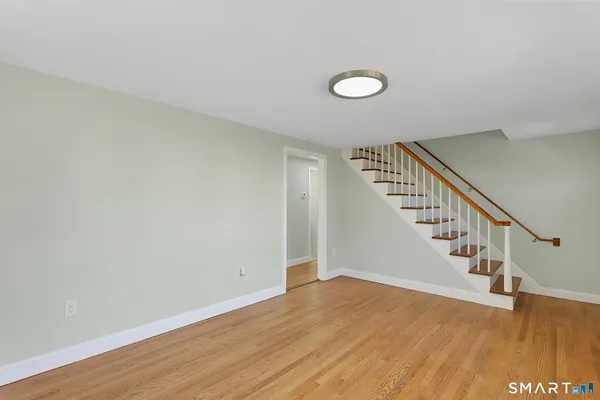 a kitchen with stainless steel appliances granite countertop a stove a refrigerator and a sink