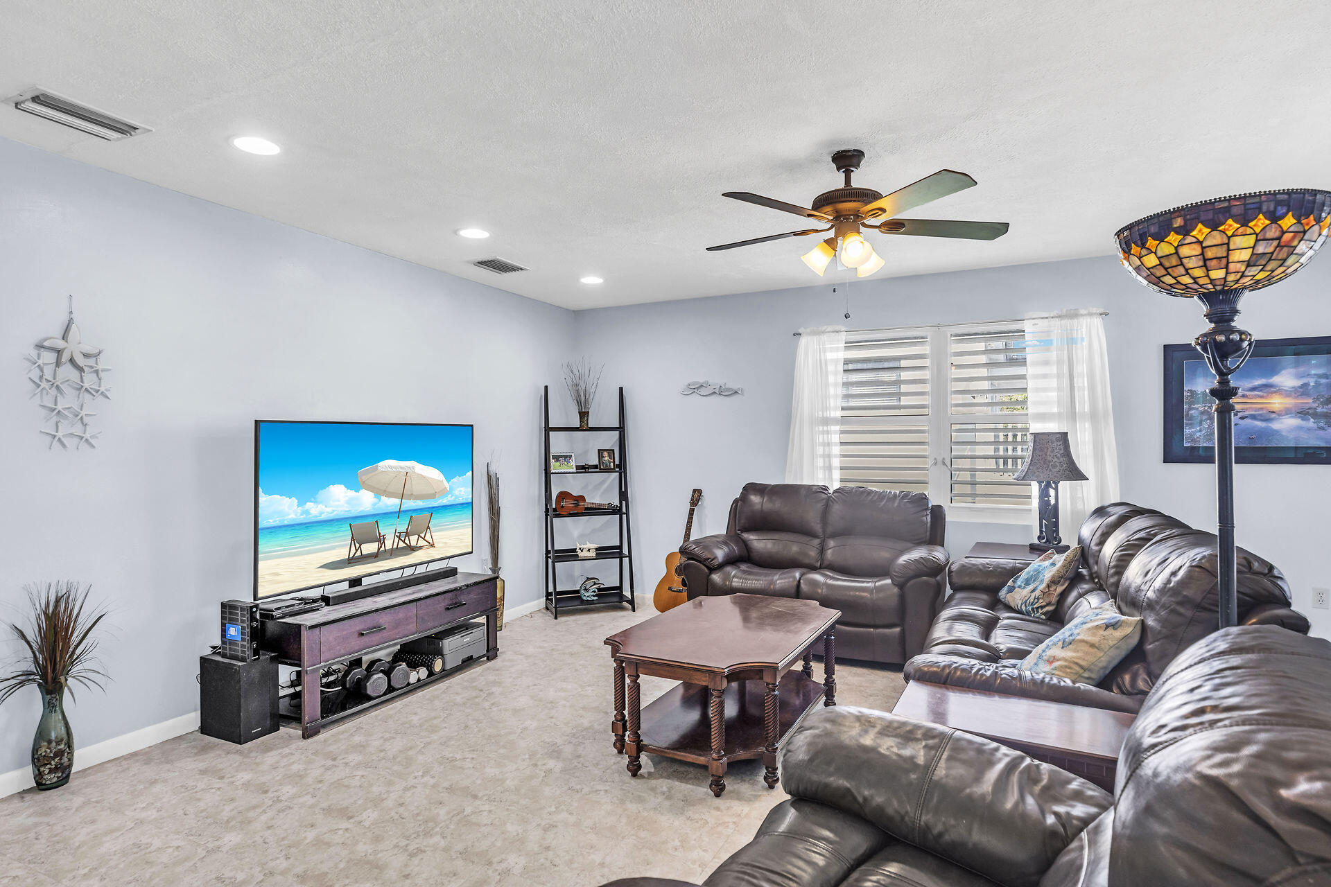 106 Channel Drive, Unit B Marathon, FL 33050 - Photo 16 of 33 a living room with furniture a ceiling fan and a flat screen tv