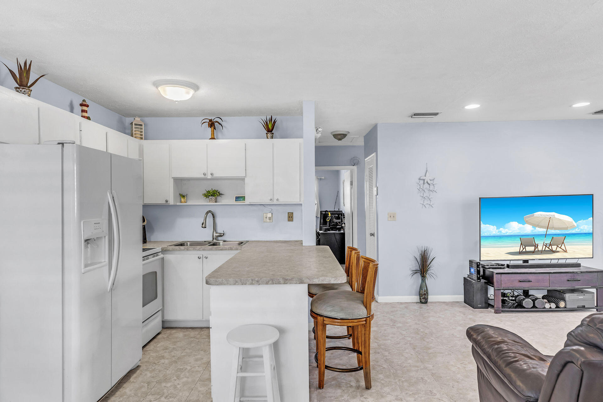 106 Channel Drive, Unit B Marathon, FL 33050 - Photo 17 of 33 a kitchen that has a cabinets and refrigerator