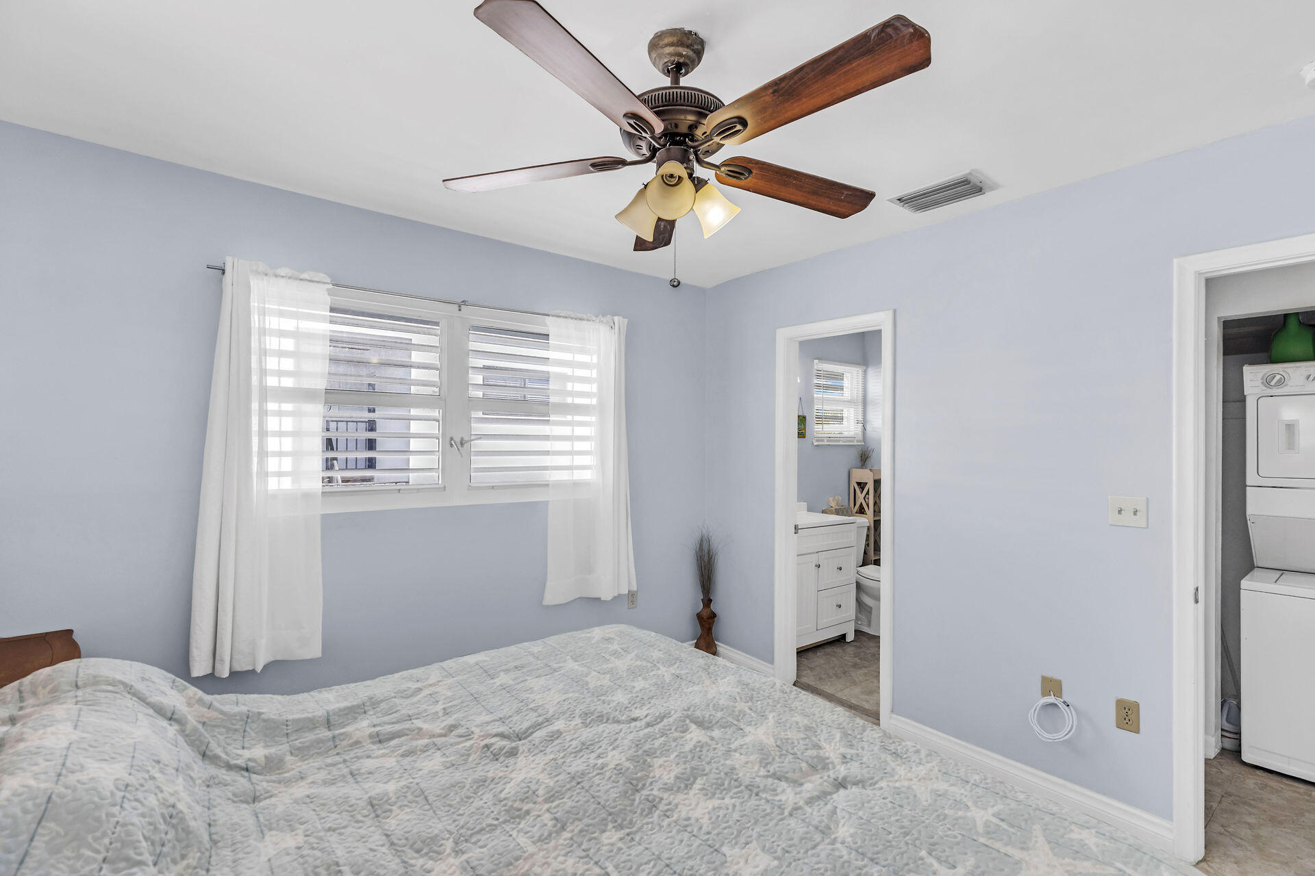 106 Channel Drive, Unit B Marathon, FL 33050 - Photo 21 of 33 a view of a bedroom with a ceiling fan and a window