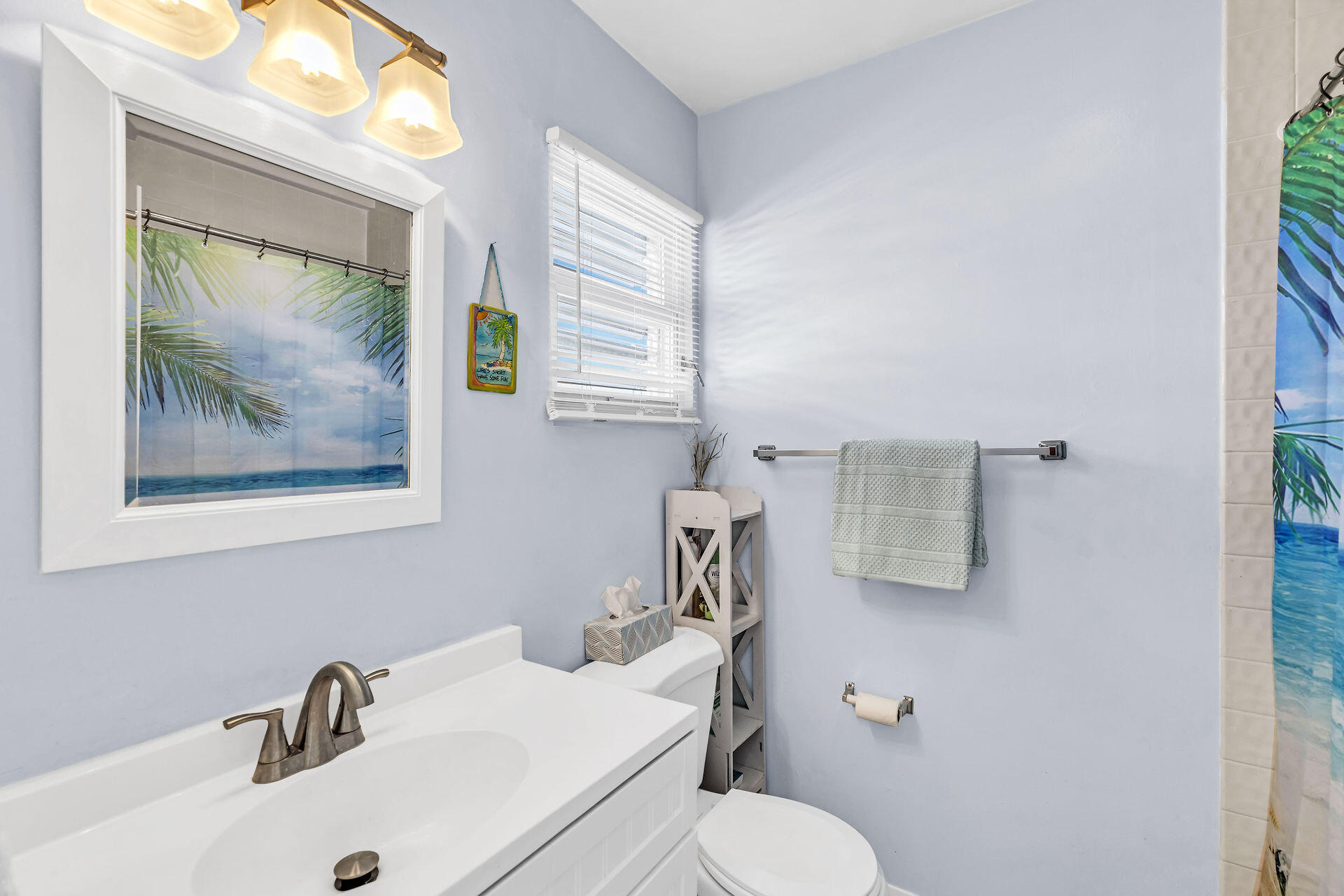 106 Channel Drive, Unit B Marathon, FL 33050 - Photo 5 of 33 a bathroom with a sink mirror and toilet