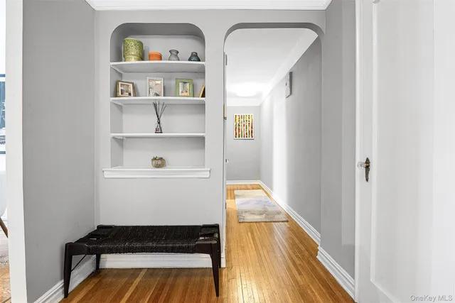 a view of utility room and wooden floor