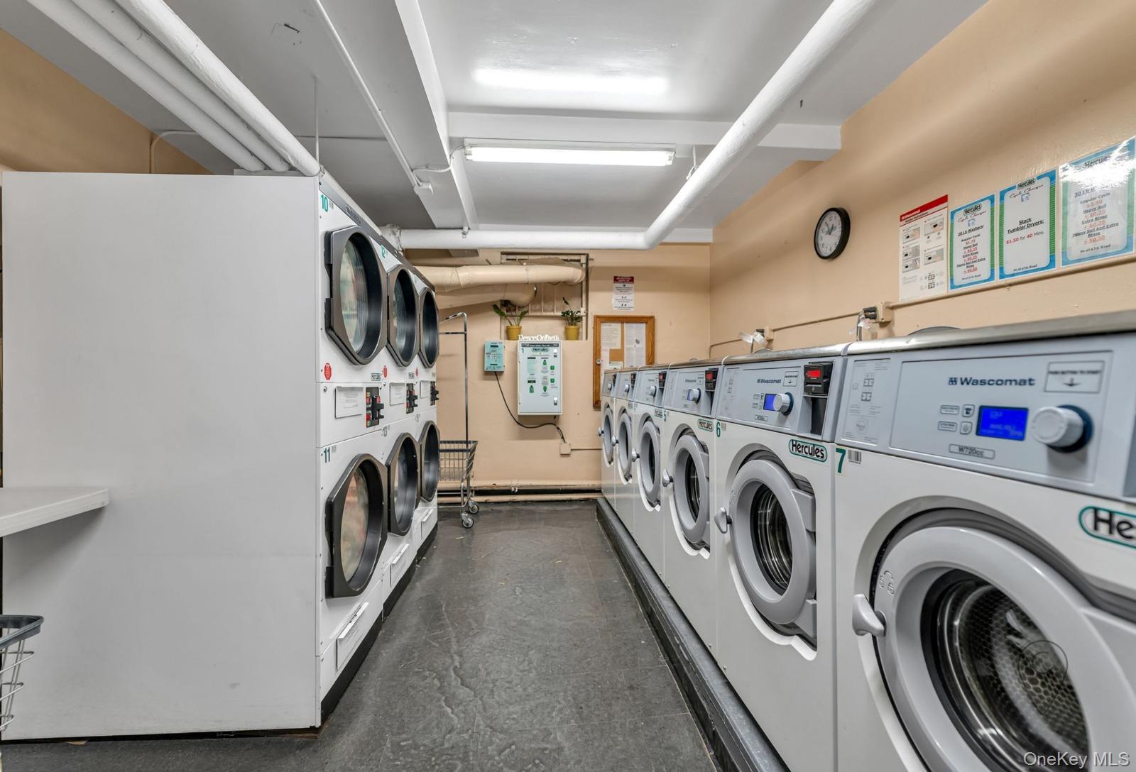 99-45 67th Road, Unit 514 Queens, NY 11375 - Photo 22 of 22 a utility room with dryer and washer