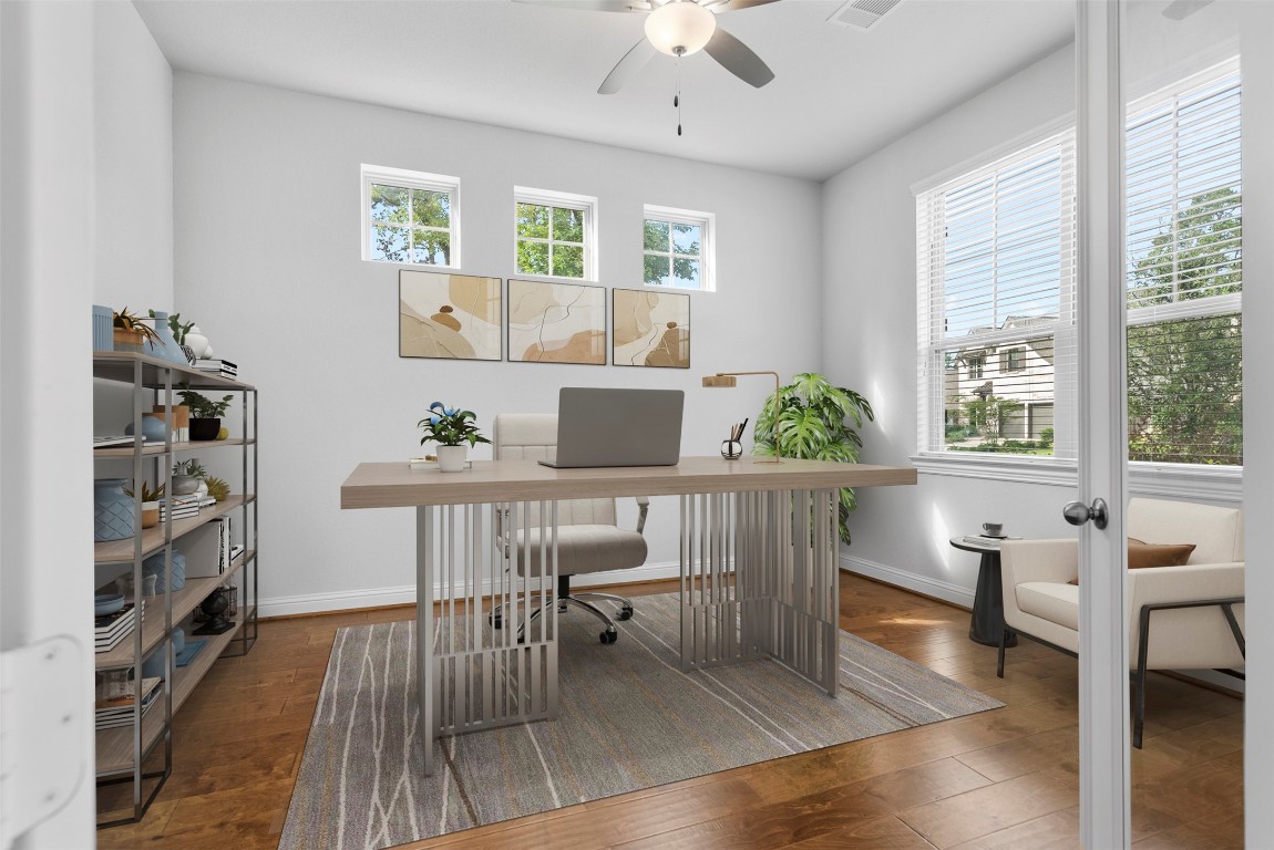 148 Gray Pne Grove Conroe, TX 77318 - Photo 11 of 46 a view of a dining room with furniture and wooden floor