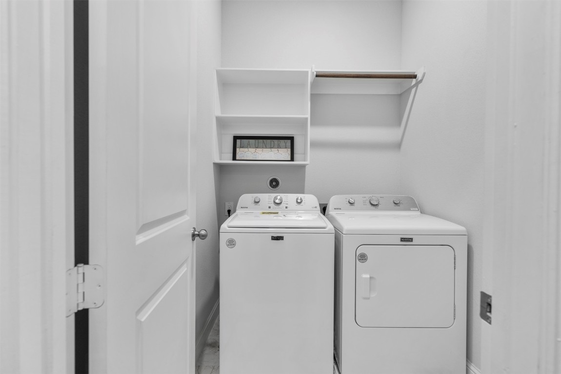 148 Gray Pne Grove Conroe, TX 77318 - Photo 14 of 46 a utility room with dryer and washer