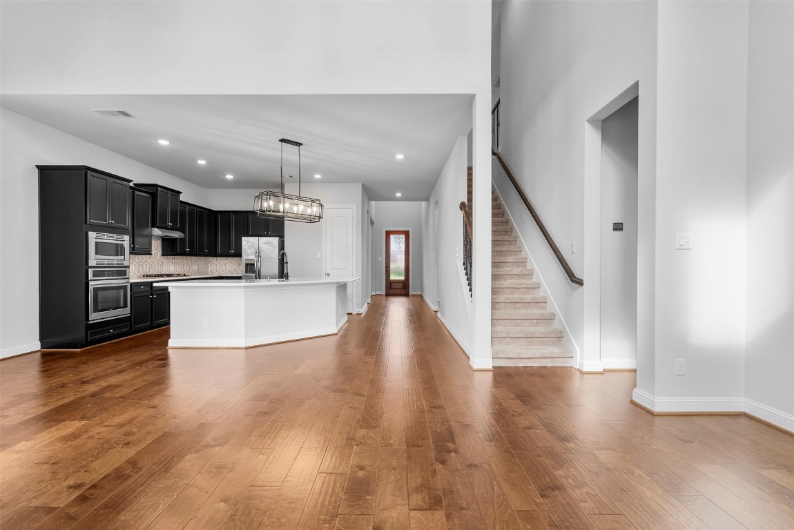 148 Gray Pne Grove Conroe, TX 77318 - Photo 20 of 46 a view of kitchen with cabinets and wooden floor