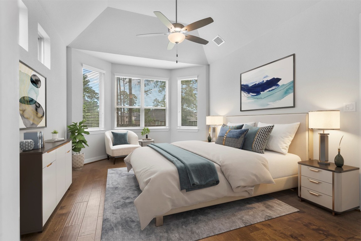 148 Gray Pne Grove Conroe, TX 77318 - Photo 23 of 46 a large bedroom with a large bed couch and a large window