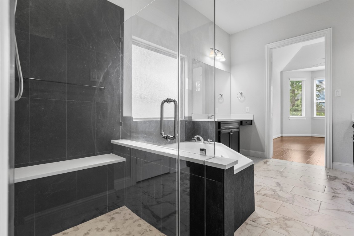 148 Gray Pne Grove Conroe, TX 77318 - Photo 25 of 46 a large bathroom with a double vanity sink a mirror and a bathtub