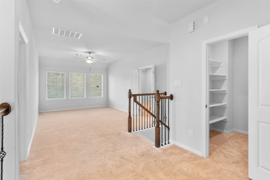 148 Gray Pne Grove Conroe, TX 77318 - Photo 29 of 46 a view of a hallway with windows