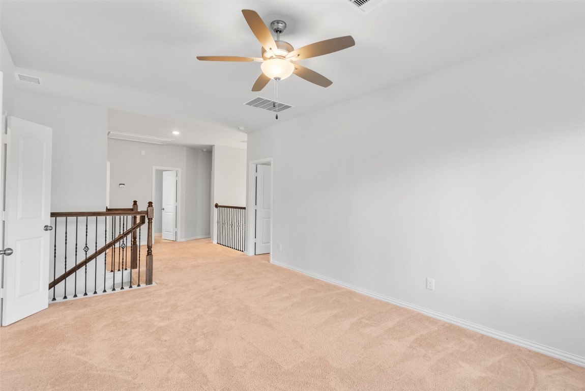 148 Gray Pne Grove Conroe, TX 77318 - Photo 30 of 46 a view of a hallway with a ceiling fan