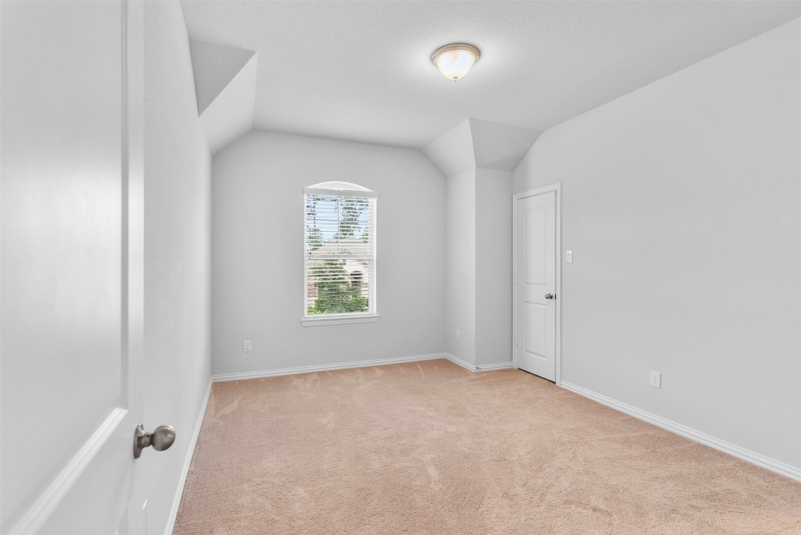 148 Gray Pne Grove Conroe, TX 77318 - Photo 32 of 46 an empty room with windows