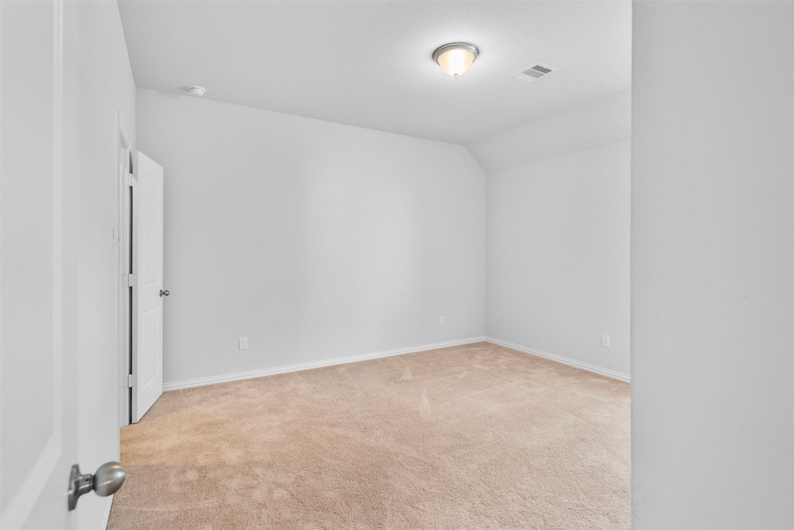 148 Gray Pne Grove Conroe, TX 77318 - Photo 33 of 46 an empty room with an entryway