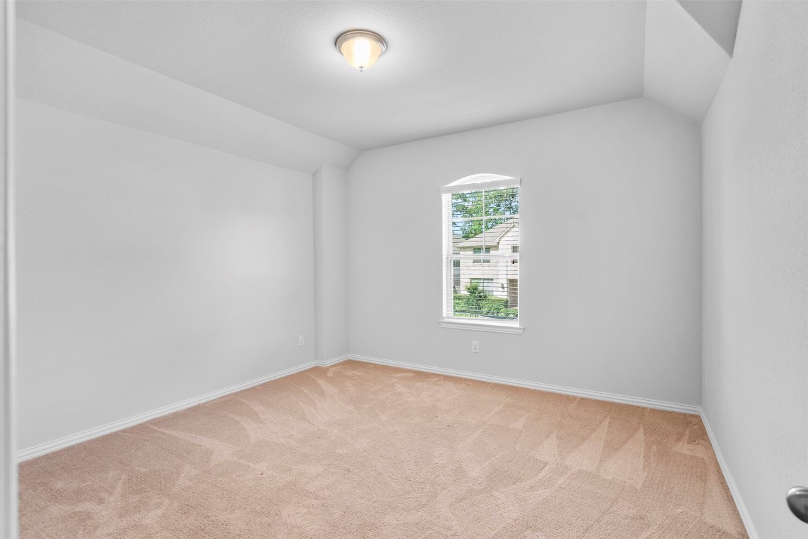 148 Gray Pne Grove Conroe, TX 77318 - Photo 34 of 46 an empty room with a window