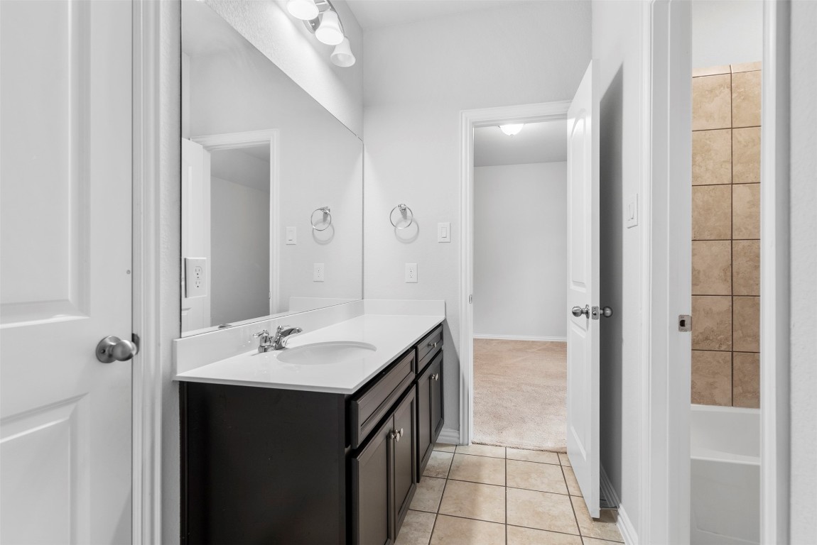 148 Gray Pne Grove Conroe, TX 77318 - Photo 35 of 46 a bathroom with a double vanity sink a and mirror